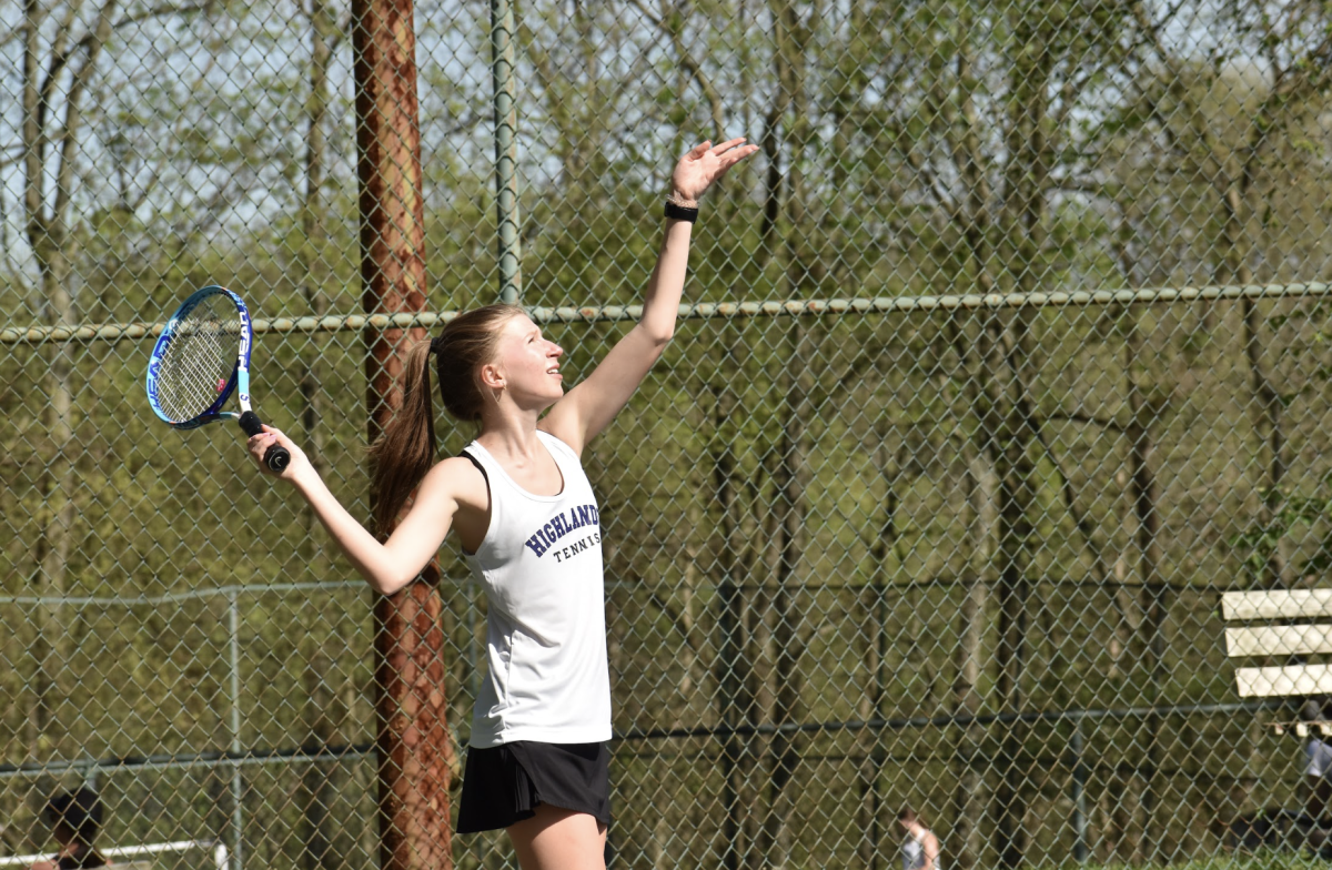 Sophomore, Liza Zengel serves the ball in her doubles match.